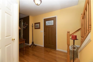 Spacious foyer with hardwoods.  Newer front door.