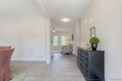 Foyer has Laminate Wood Floors & Leads to the Fami
