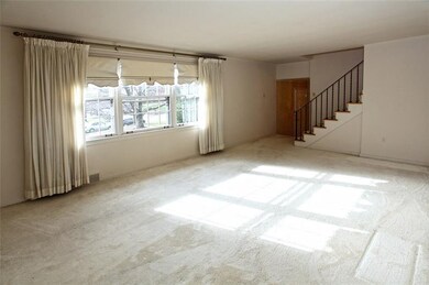 Spacious Living Room with hardwoods under the carp