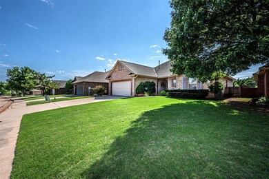 Ranch-style house featuring a front yard and a gar