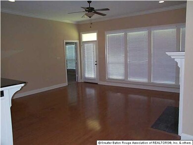Wood floors in den area.