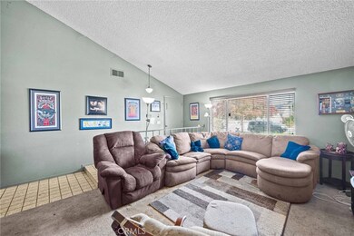 Another angle of living room with a lot of natural light.