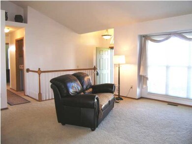 AN ALTERNATE VIEW OF THE LIVING ROOM FROM THE DINI