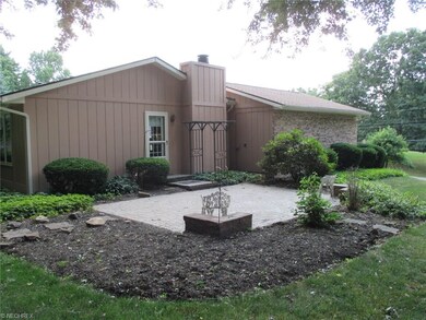 Side view of home with paver patio