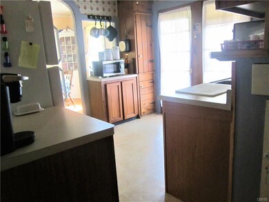 Kitchen with doors leading to side porch