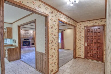 As you step inside this well-maintained home you e
