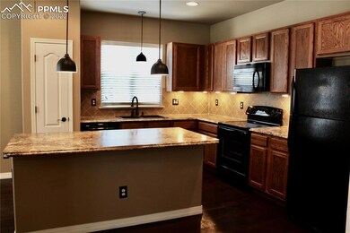 Kitchen has nice size island with space for stools