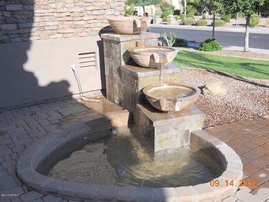 Water fountain in front of house