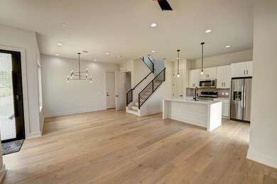 Kitchen featuring recessed lighting, white cabine
