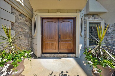 Inviting double-door front entry welcomes you to t
