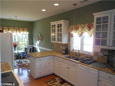 Kitchen - Hardwood floors, recessed lighting, pant