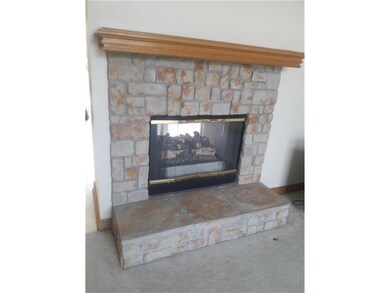 LIVING ROOM VIEW OF SEE-THROUGH FIREPLACE
