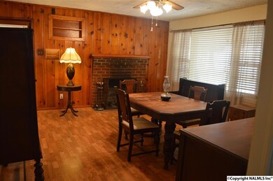 Can't you imagine dining here with a cozy fire going, every so often glancing out the large window to enjoy the river view?