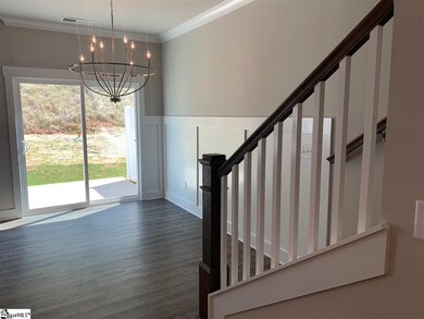 Breakfast/dining area overlooks yard and opens to 