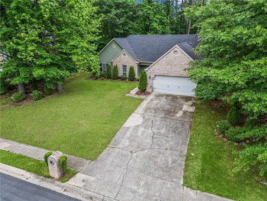 View of front of home with driveway, an attached g