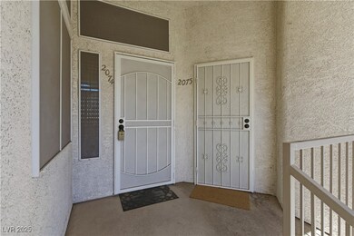 Entrance to property with stucco siding