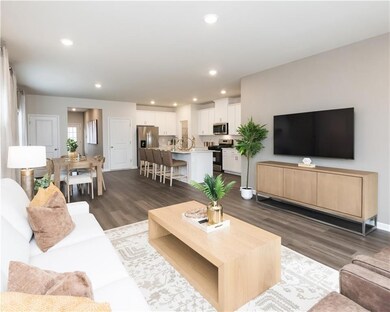 Living area featuring recessed lighting and dark wood-style flooring