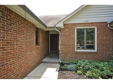 Entry. Lovely landscaping greets visitors at the inviting entrance.