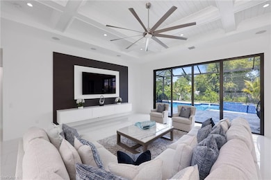 Living room with recessed lighting, beamed ceiling