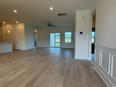 Unfurnished living room featuring crown molding, ceiling fan, light wood-style floors, and recessed lighting