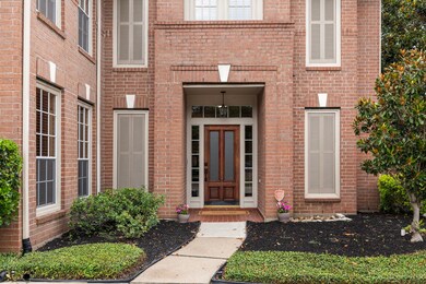 The entrance features a welcoming natural wooden f