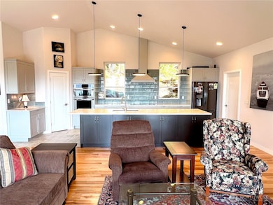 Spacious & good-looking great room. Dining area is out of the photo frame to the left.