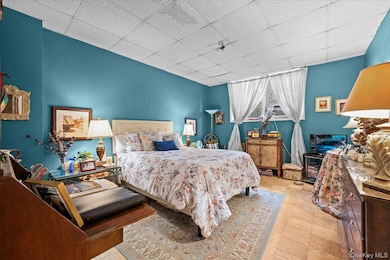 Bedroom featuring a drop ceiling
