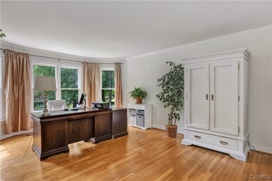 Spacious living room with wood floor and a large b