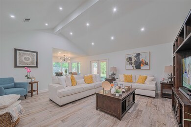 Living space with high ceilings, ambient lighting, and lots of natural light.