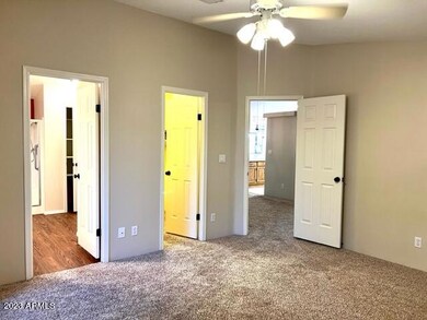 MASTER BEDROOM WALK IN CLOSET AND TO LIV