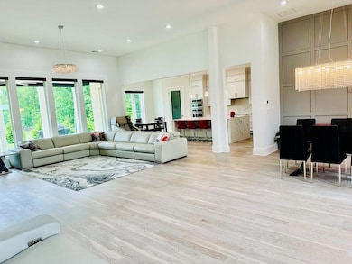 Living room featuring recessed lighting, light woo