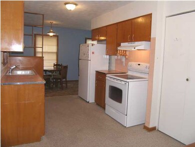 The east wall of the kitchen. Note the range and r