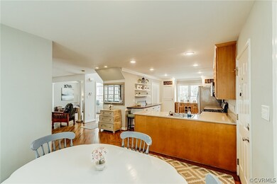 Breakfast nook is bright and sunny and opens to th