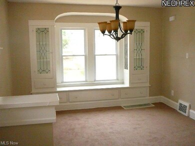 DINING ROOM-W/WINDOW SEAT & CHINA CABINETS