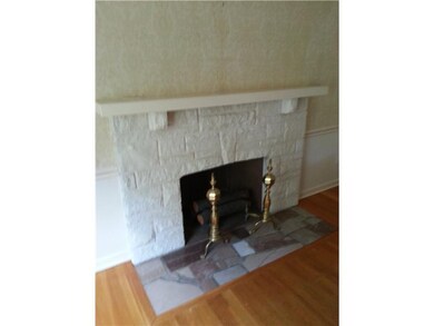 Living Room. THE LARGE LIVING ROOM S FOCAL POINT IS THE LOVELY WOOD BURNING FIREPLACE.