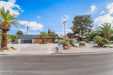 View of front of property featuring driveway and a