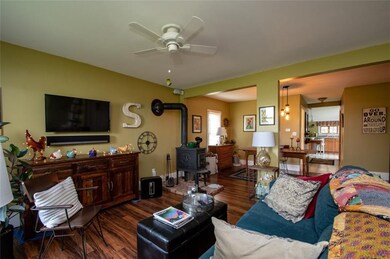 The wood stove adds warmth and a cozy ambience.