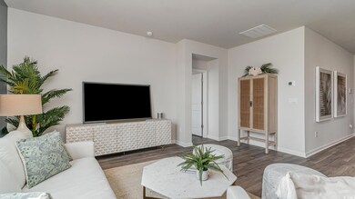Living area featuring wood finished floors and baseboards