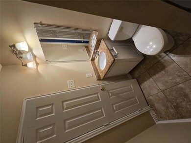Bathroom featuring tile patterned flooring and toi