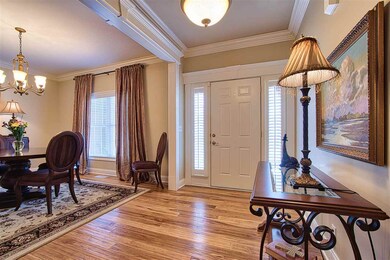 Foyer welcomes guests with beautiful hand scraped 