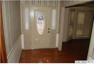 Beautiful foyer with hardwood floors.