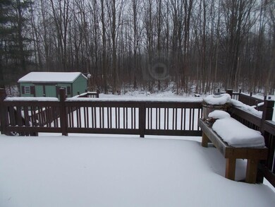 View of back deck and pool area as seen from dinin