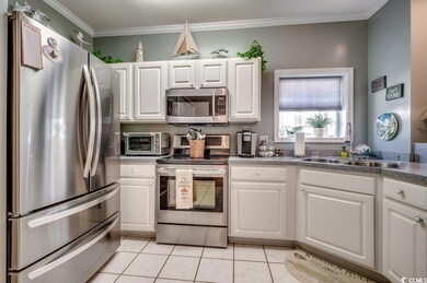 Kitchen featuring stainless steel appliances, whit