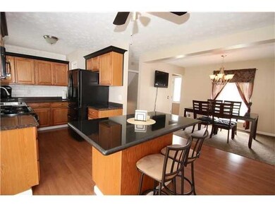 Open floor plan with Kitchen and Dining room.  Sli