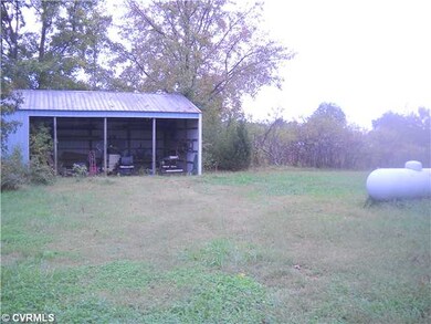 Land - land with shed on side of house