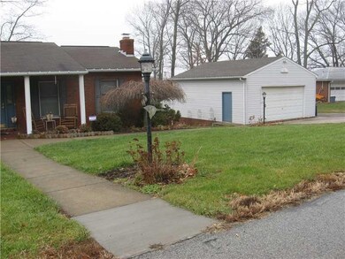 Exterior Front. Large detached garage and space fo