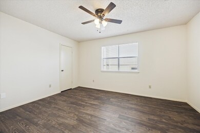 Unfurnished room with baseboards, a ceiling fan, 