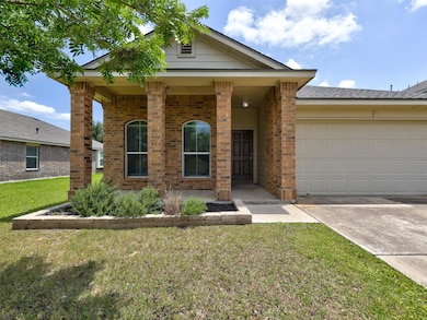 View of front of property featuring concrete driv