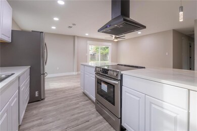 View over kitchen counter into Living room