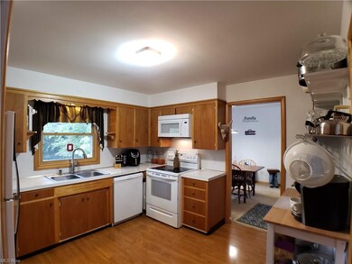 view of kitchen from garage/basement doors